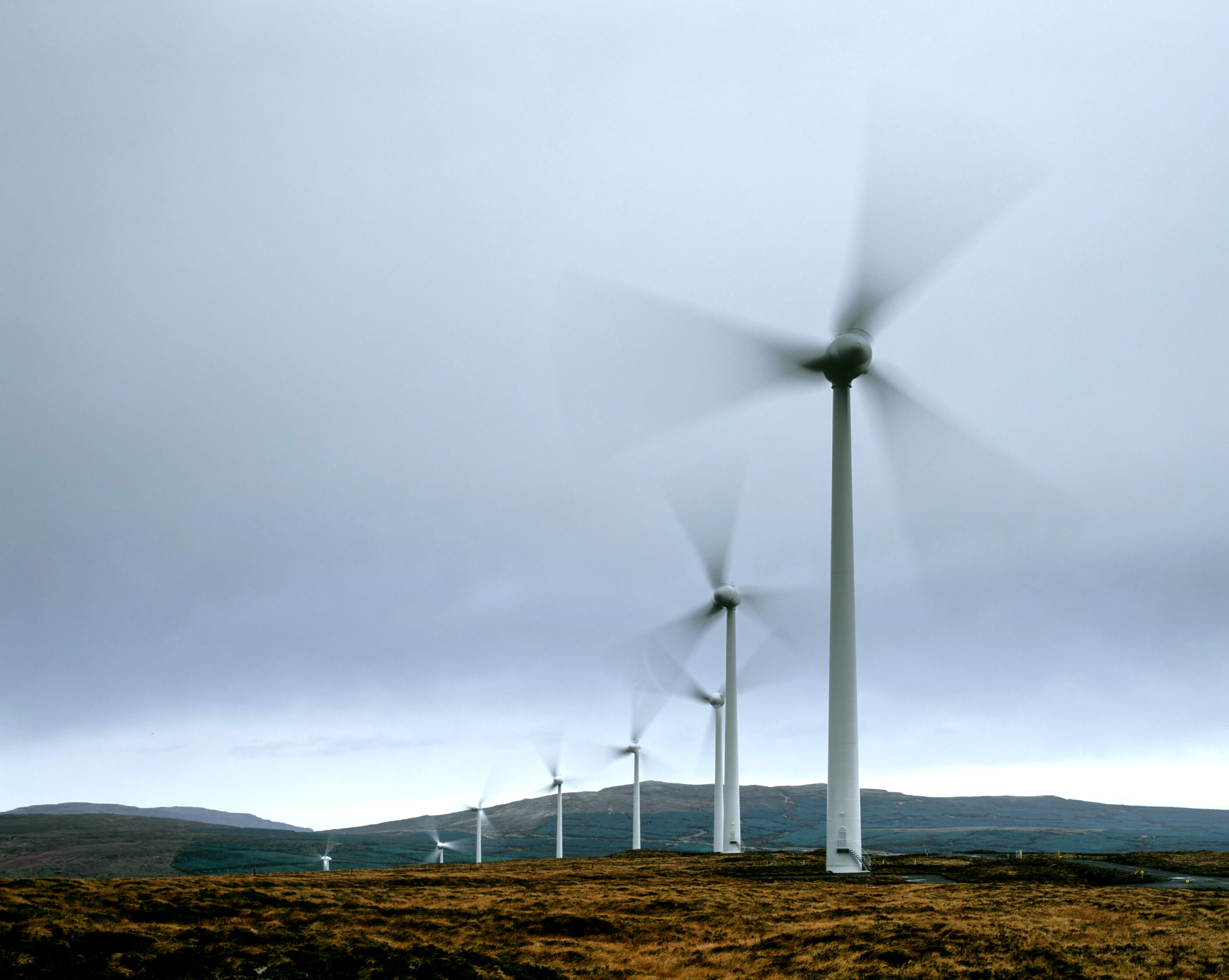Wind turbines at Ben Aketil, blades blurred